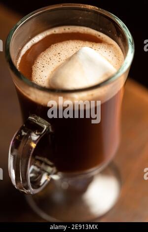 A hot chocolate drink with Mezcal, served with marshmallows in a glass mug Stock Photo