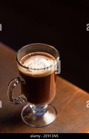 A hot chocolate drink with Mezcal, served with marshmallows in a glass mug Stock Photo
