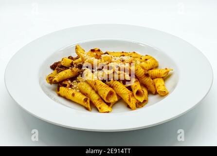 Dish of Garganelli, traditional Italian pasta. Garganelli, tubular in shape ith a characteristic perpendicular groove. Stock Photo