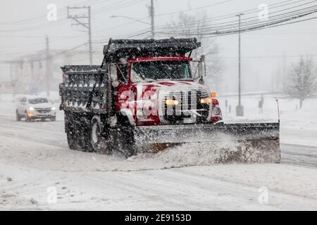 NORWALK, CT, USA -FEBRUARY 1, 2021:  Snow plow truck  during snow storm  day on Connecticut Ave. Stock Photo