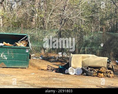 Burke County, Ga USA - 01 28 21: A rural county public waste trash dump for local residents trash pile toilet tire waste Stock Photo