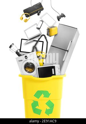Different modern devices and gadgets falling into trash bin with recycling sign on white background Stock Photo