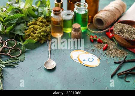 Alchemical symbols and ingredients for preparing potions on color background Stock Photo