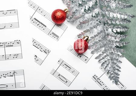 Music sheets with notes and Christmas decor Stock Photo