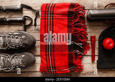 Equipment for hiking on wooden background Stock Photo