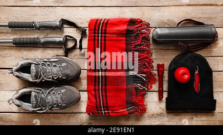 Equipment for hiking on wooden background Stock Photo
