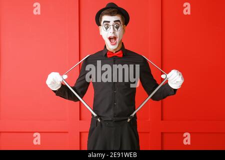 Male pantomimist on color background Stock Photo