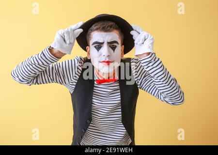 Male pantomimist on color background Stock Photo