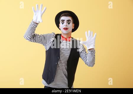 Male pantomimist on color background Stock Photo