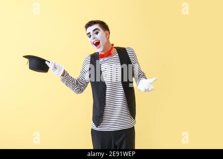 Male pantomimist on color background Stock Photo