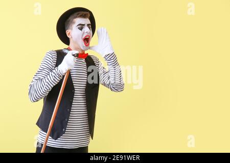 Male pantomimist on color background Stock Photo