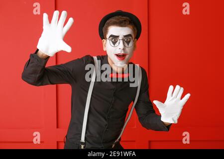 Male pantomimist on color background Stock Photo