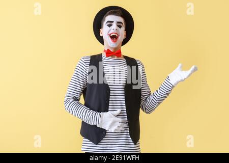 Male pantomimist on color background Stock Photo