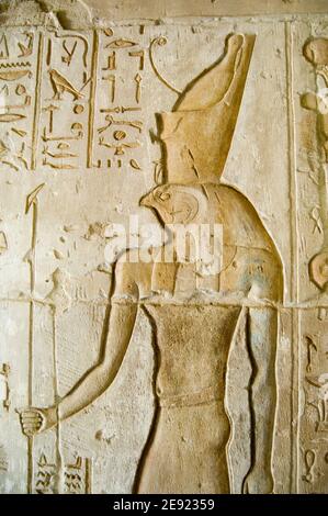 Ancient Egyptian bas relief of the falcon headed god Horus. Ptolemaic temple at Deir el Medina at Luxor, Egypt. Ancient temple, over 2000 years old. Stock Photo