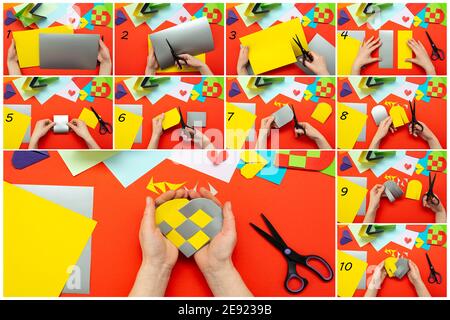 DIY instruction. Step by step guide. The process of making a paper heart from yellow and gray colored paper for Valentine's Day. Stock Photo