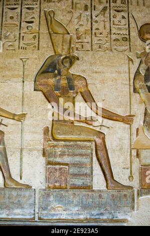 Ancient Egyptian bas relief carving on inner wall of Ptolemy Temple at Deir el Medina, Luxor.Ancient sculpture, over 1000 years old. Stock Photo