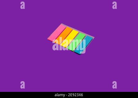 set of sticky notes on a purple surface Stock Photo