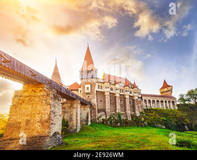 Bridge leading across moat to Corvin Castle in hunedoara at dawn Stock Photo