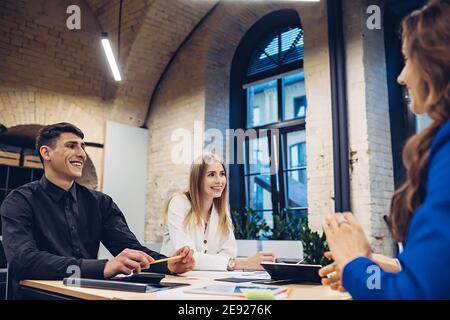 businesspeople discussing at table in office Stock Photo