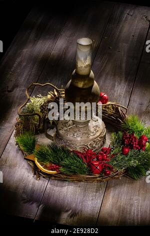 Old handmade lamp and christmas garland on an old wooden background Stock Photo