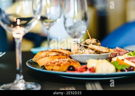 Appetizers platter at a restaurant on a table Stock Photo