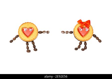 Two characters made of round cookies decorated with red jelly hearts and coffee beans trying to reach each other. Creative flat lay isolated on white. Stock Photo