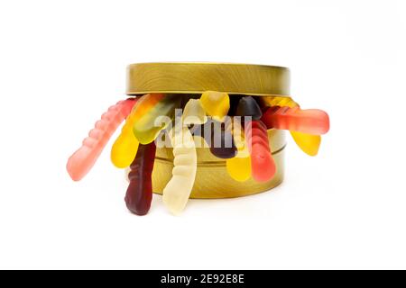 Vivid gummy worms in a round tin box isolated on white Stock Photo