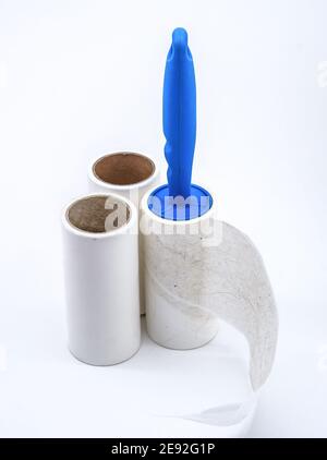 roller for cleaning clothes from wool, pet hair on clothes, Roller cleans clothes Stock Photo