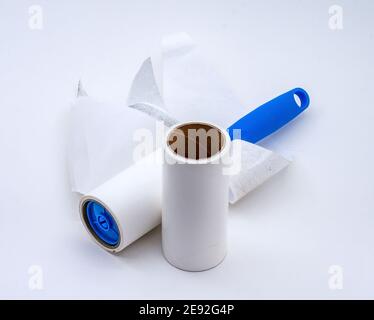 roller for cleaning clothes from wool, pet hair on clothes, Roller cleans clothes Stock Photo