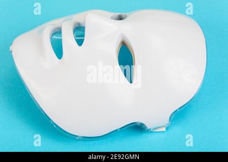 LED face mask. A device for lightening and rejuvenating the skin. Collagen therapy. Stock Photo