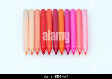 Set of red colored marker pens on white background. Different shades of red. Design and creativity concept Stock Photo