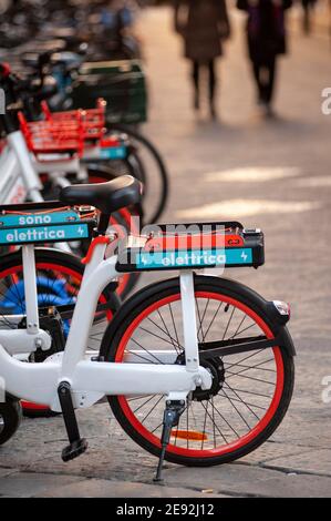 Modern electric bike parked on a narrow forest trail blocked by a ...