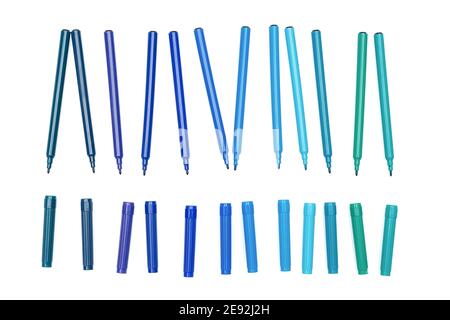 Various of blue colored markers pens with cap off on isolated background. Different shades of blue color. Design and creativity concept Stock Photo