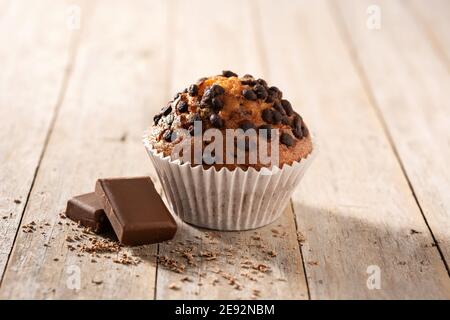 Just baked chocolate muffin on wooden table Stock Photo