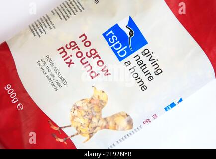 A 900g bag of no grow ground mix wild bird food for winter feeding with RSPB logo on packet. Stock Photo