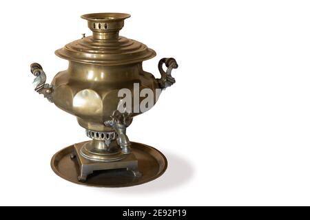 old copper samovar isolated on white background. Vintage device for boiling water and making tea. metal russian teapot Stock Photo