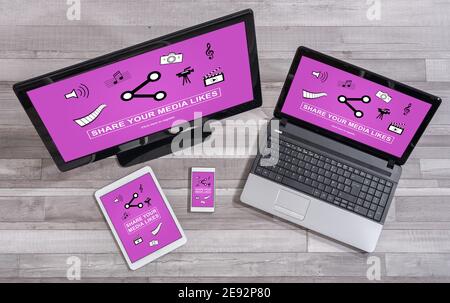 Media likes sharing concept shown on different information technology devices Stock Photo