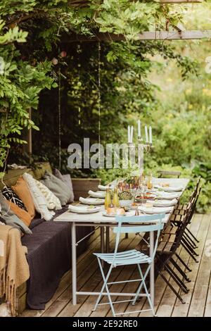 Table ready for dinner party at back yard Stock Photo