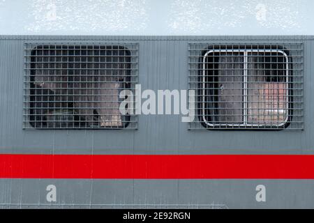 Steel bars on the windows of a russian riot police bus for arrested people at the political rally Stock Photo