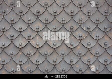 Medieval rusty metal grey scales armor background. Template for border, frame design. Stock Photo