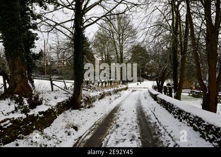 Road to Brewery Hook Norton Village with Snowfall Stock Photo