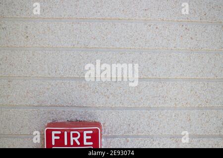 Fire alarm button red square box style attached to the wall, stock photo Stock Photo