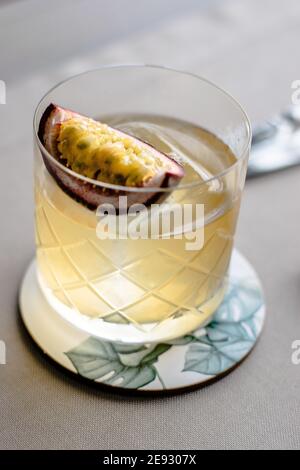 Old fashioned cocktail with a twist with passion fruit Stock Photo