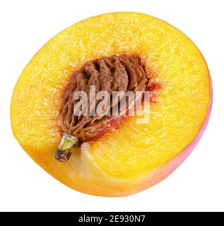 Ripe half peach fruit with nut isolated on white background with clipping path. Full depth of field. Stock Photo