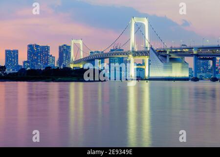 Sunset view of the city skyline and the Rainbow Bridge, in Tokyo, Japan