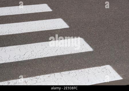 Crosswalk on road for safety when pedestrian cross the street. Road marking symbol. Zebra road with copy space. Stock Photo