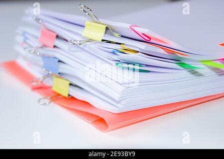 Close-up of a set of sheets attached by clips and clamps. Horizontal photography. Information overload concept Stock Photo