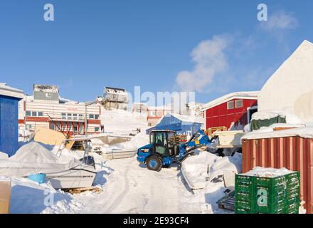 All supplies must be stored for months, as the sea ice prevents any delivery by ship.  The traditional and remote greenlandic inuit village Kullorsuaq Stock Photo