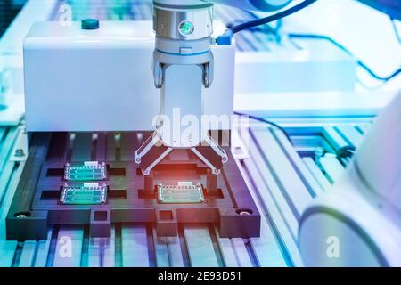 automatic robot for print circuit board (PCB)assembly machine part at factory Stock Photo