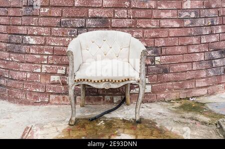 old abandoned house front with blue sofa Stock Photo
